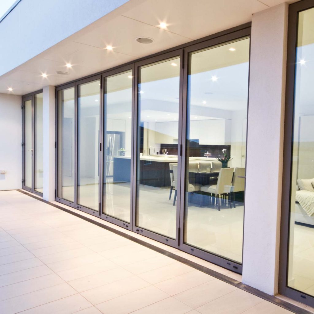 Grey aluminium bifolds fitted to new modern property