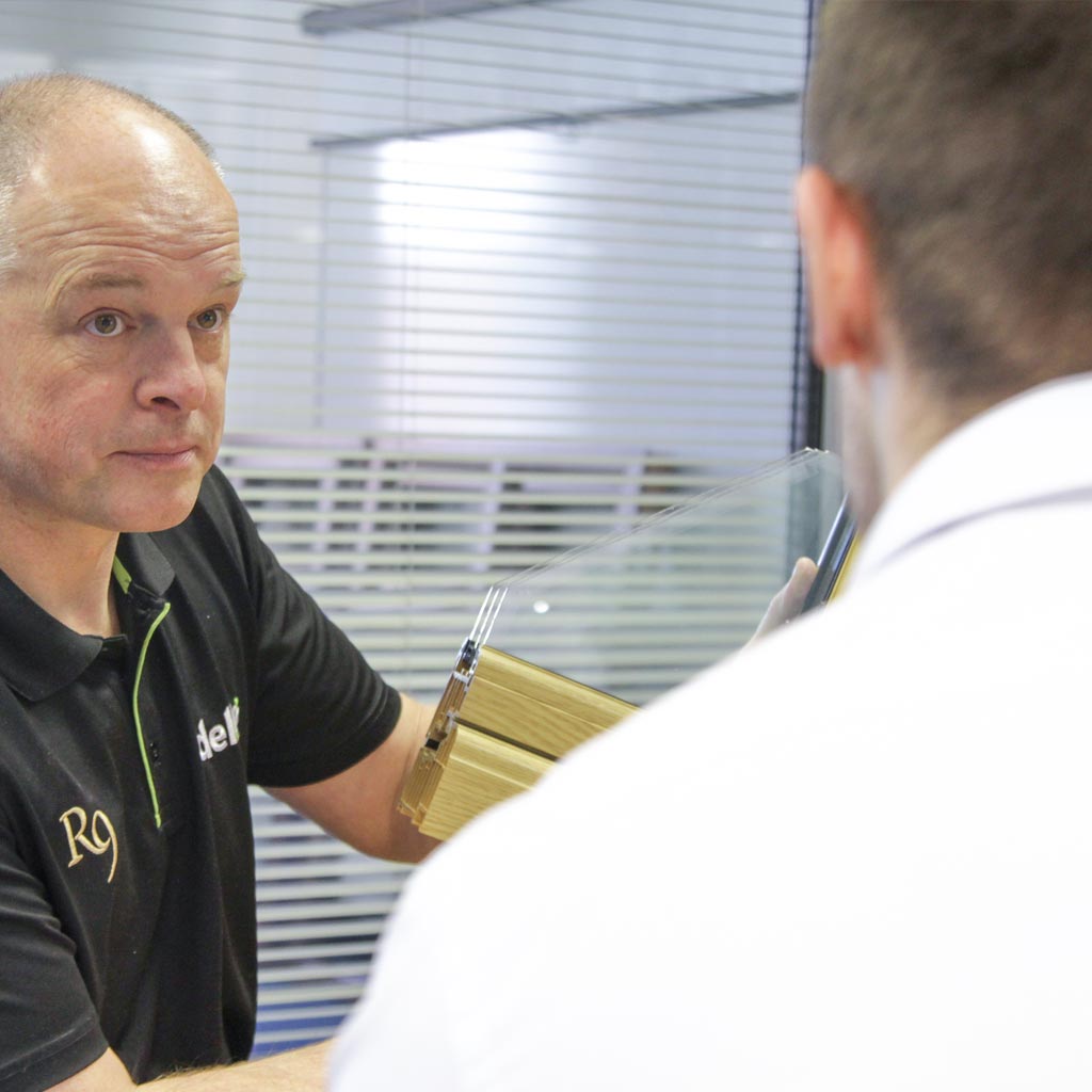 Kurt the MD with a customer discussing a product