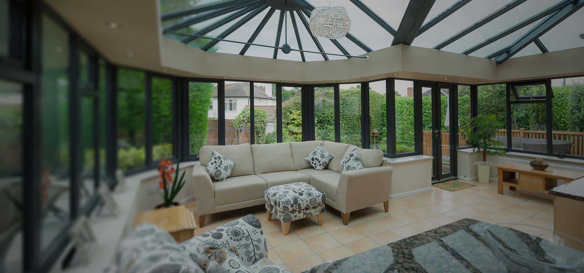 Conservatory with wall to wall windows and doors with glass roof