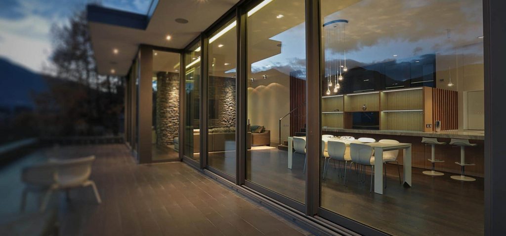 Large span of sliding aluminium patio doors with large glass area which provide a modern contemporary view