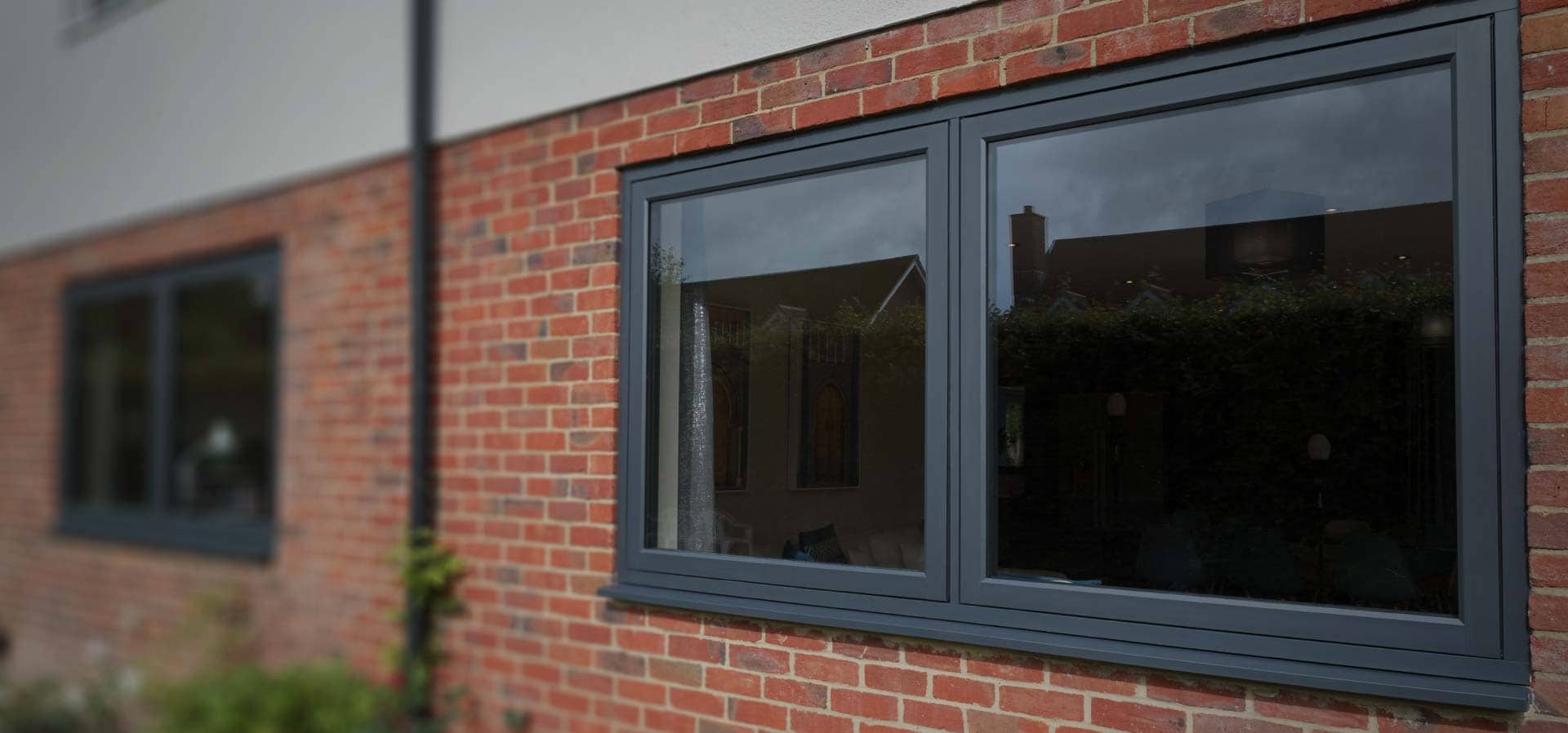 An external view of some Residence 7 upvc windows in anthracite grey finish