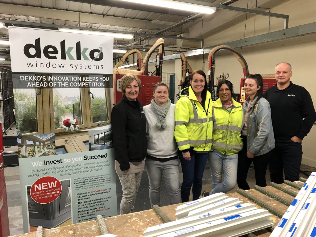 women in window factory