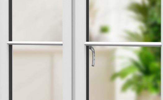Close-up of a white window with a clean, modern aesthetic, showing a simple handle and the grid pattern of the panes, emphasizing design detail and clarity.